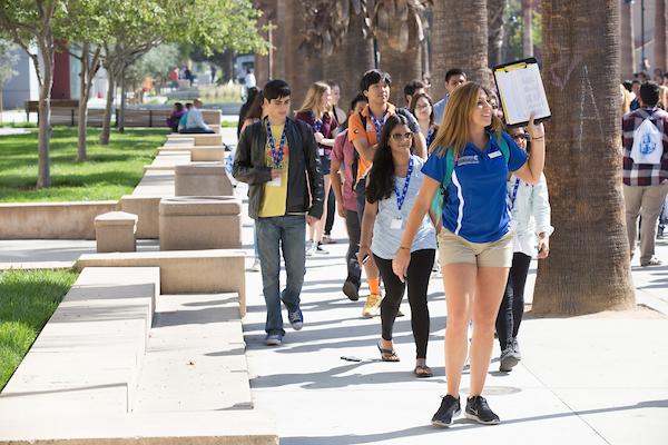 Tour guide leading students on a tour of campus.